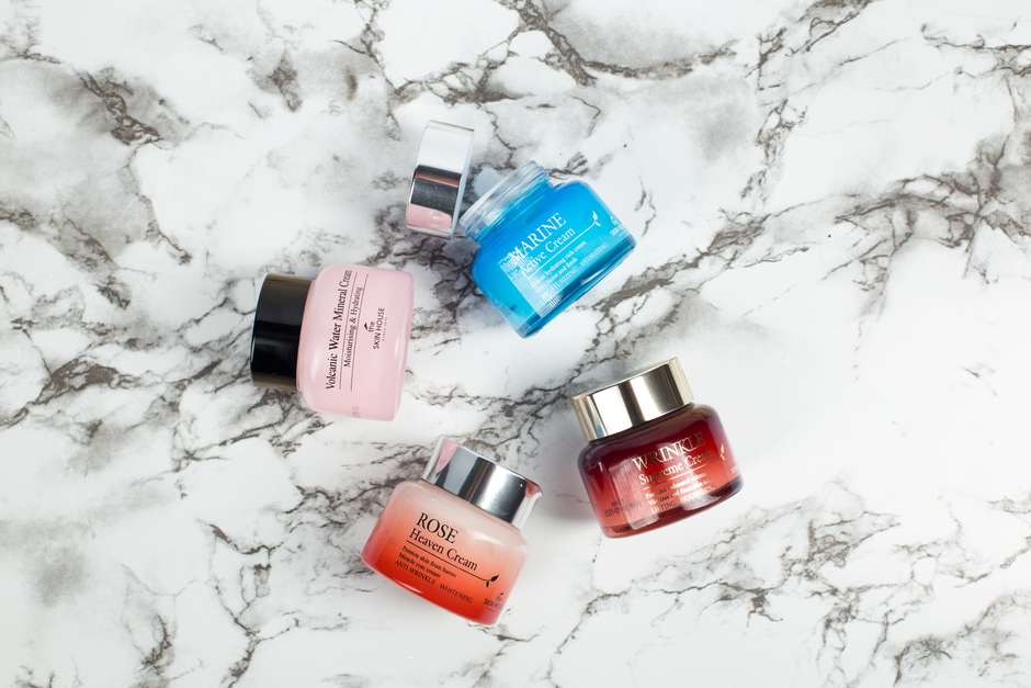 Korean beauty skincare products arranged on marble surface