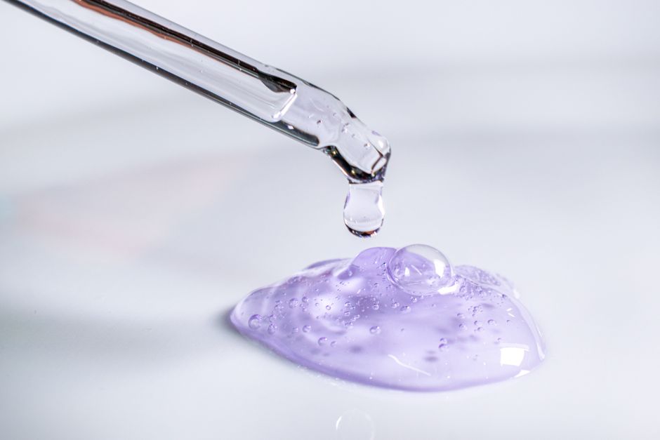 dropper bottle of serum with clean background skincare
