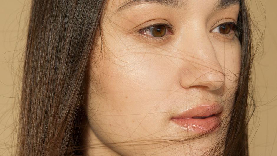 Close-up of clear, glowing skin with a dewy finish