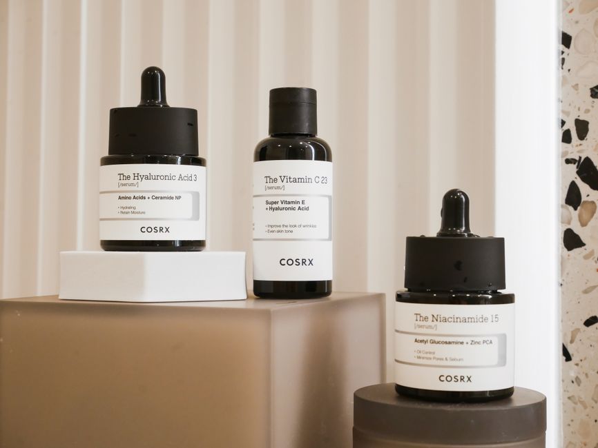 Skincare products flat lay with moisturizer and serum