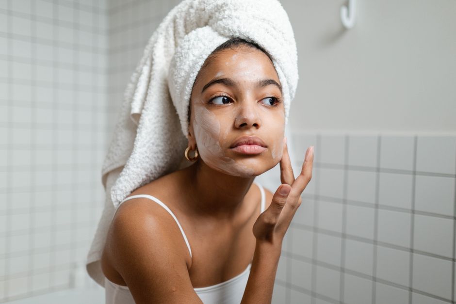 massaging oil cleanser onto face during double cleanse