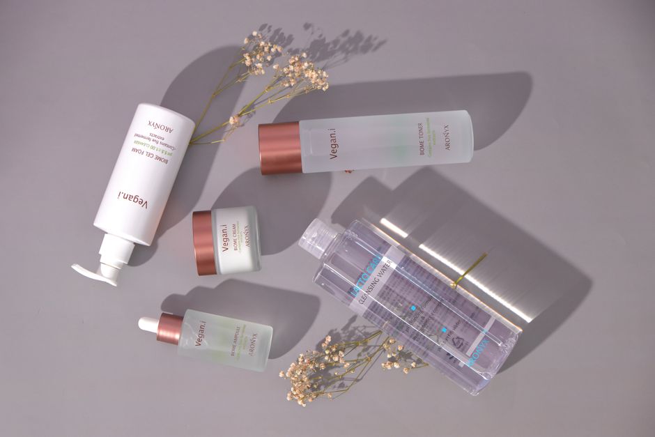 Hydrating skincare products arranged on a clean surface for a dry skin routine
