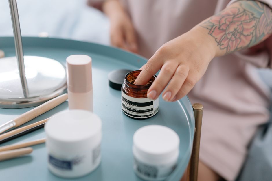 Skincare products arranged in application order from thinnest to thickest