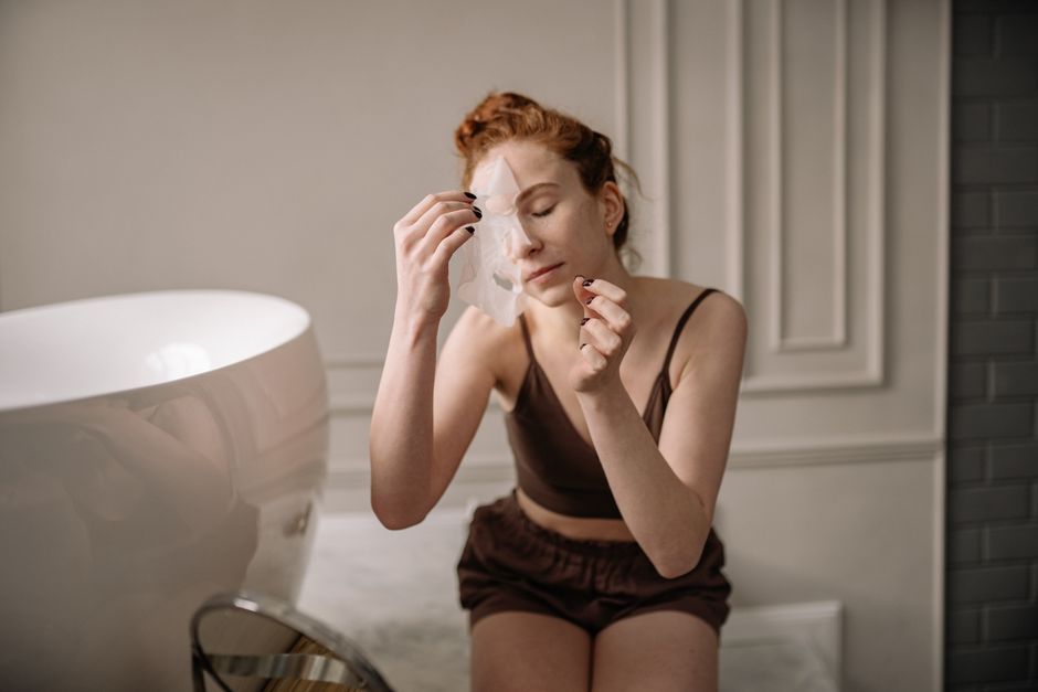 Person applying a deep conditioning hair mask treatment