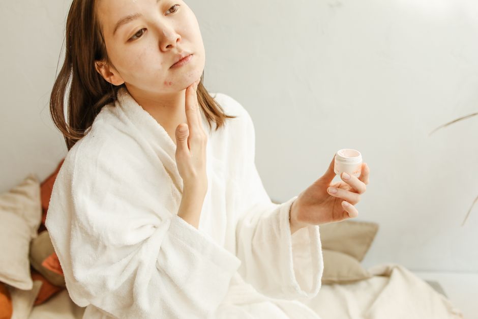 Salicylic acid and benzoyl peroxide products lined up on a bathroom counter