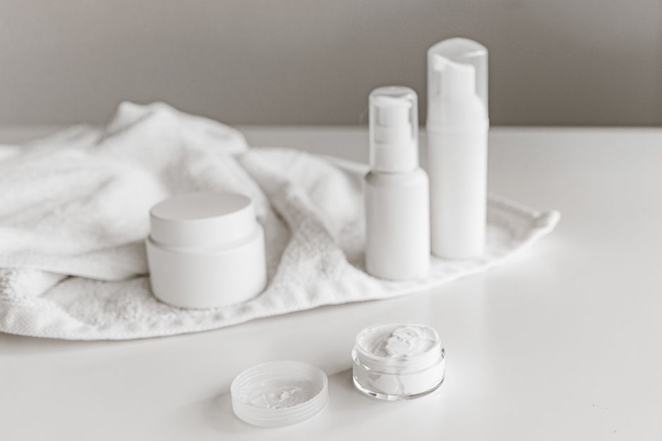 Under-eye skincare products laid out on a bathroom counter